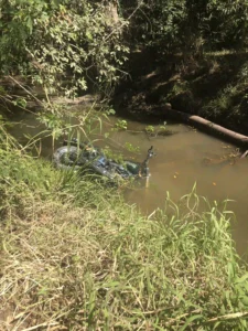 Maroochydore Towing recovering a motorbike from a creek after wet conditions.